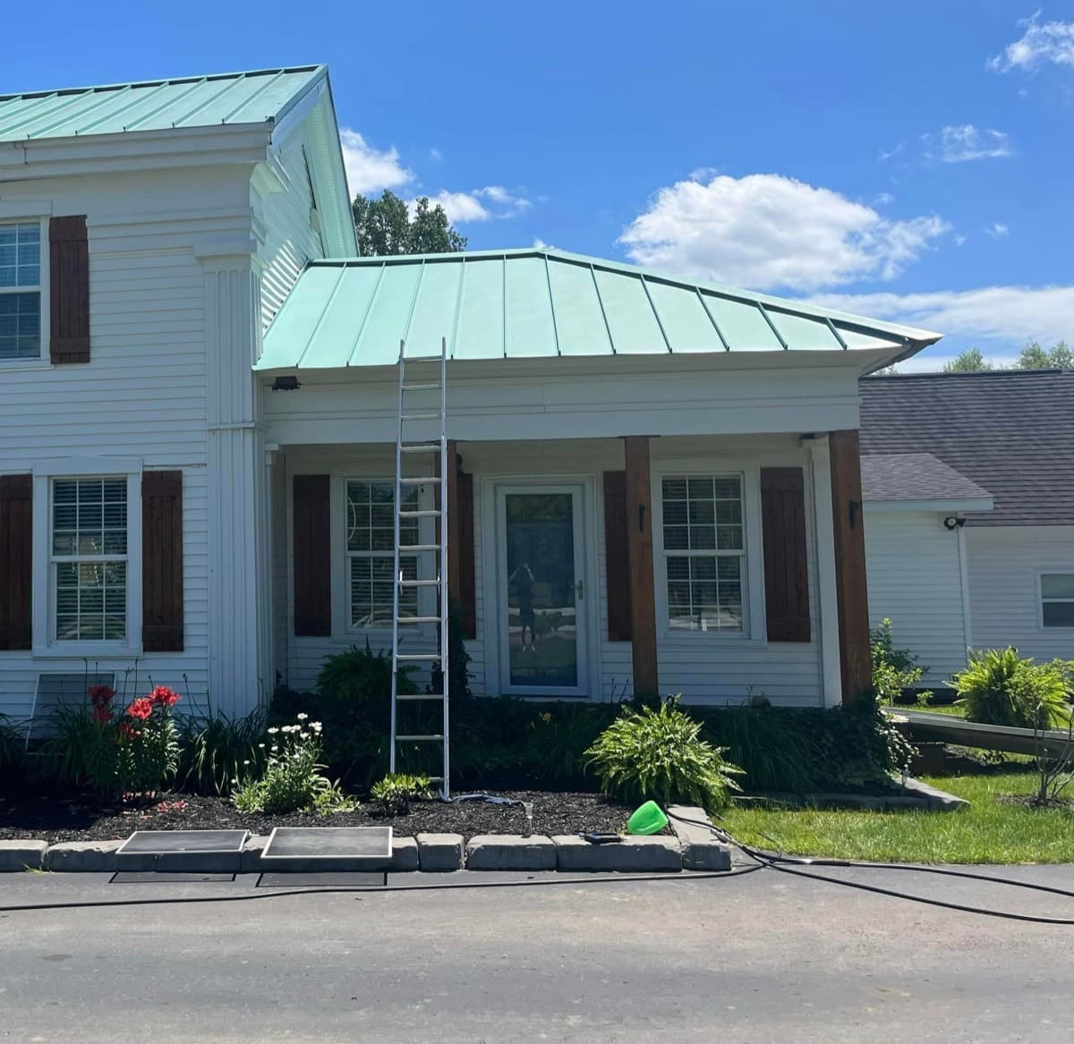 Same farmhouse bright white after exterior washing