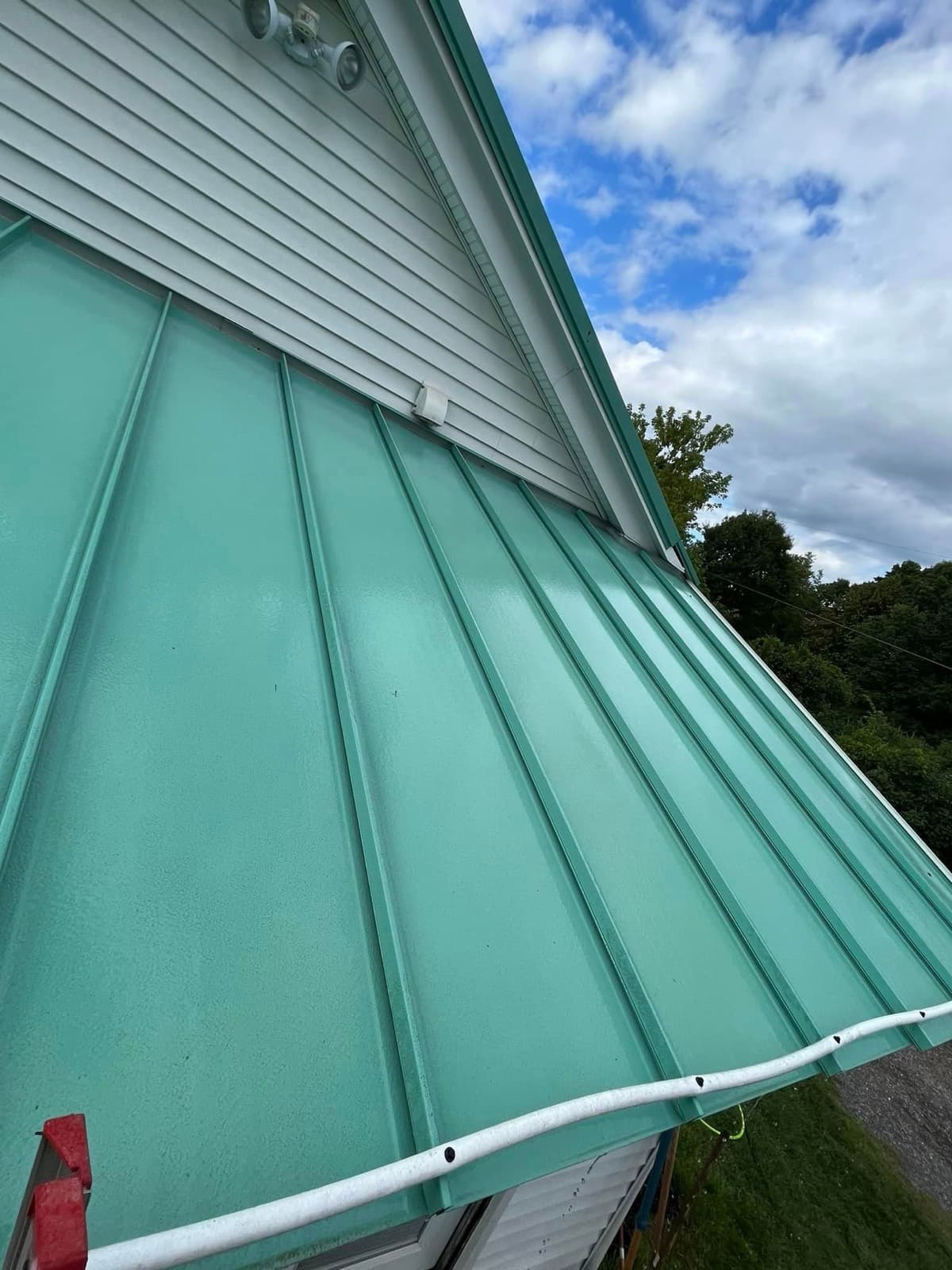 Same green metal roof clean and even after soft washing